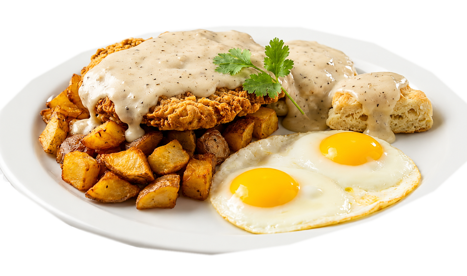 Country fried steak with two eggs, home fries, and a biscuit covered in gravy